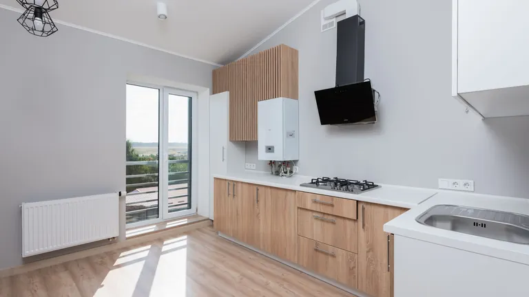 Kitchen fitted with warm timber cabinet fronts